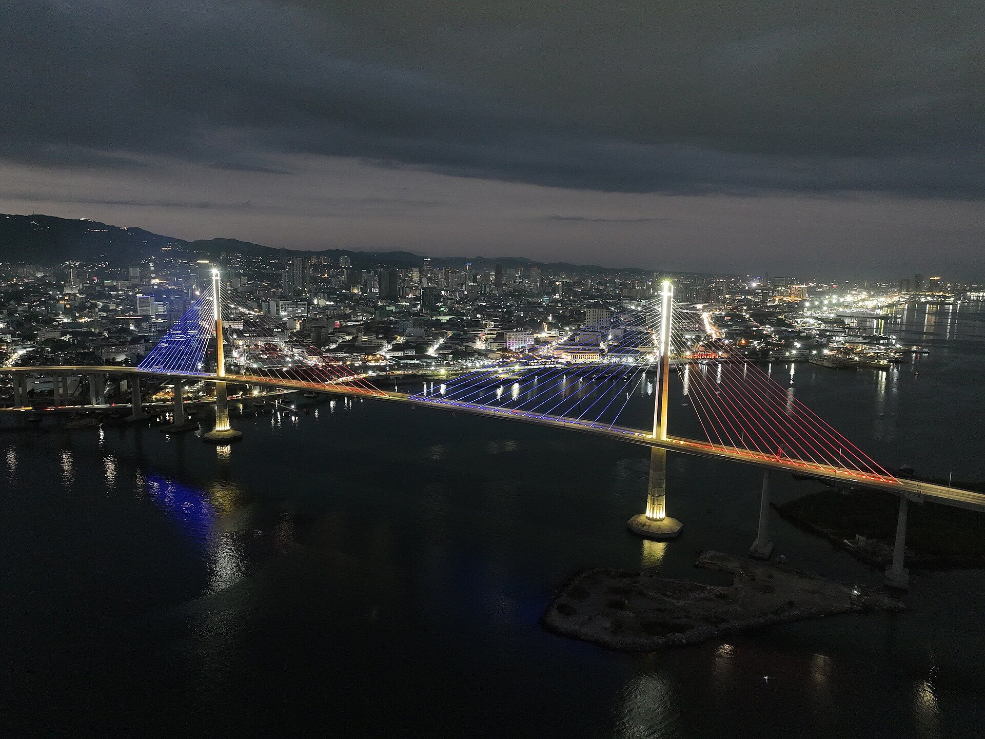 Cable-stayed bridge at dusk over water
