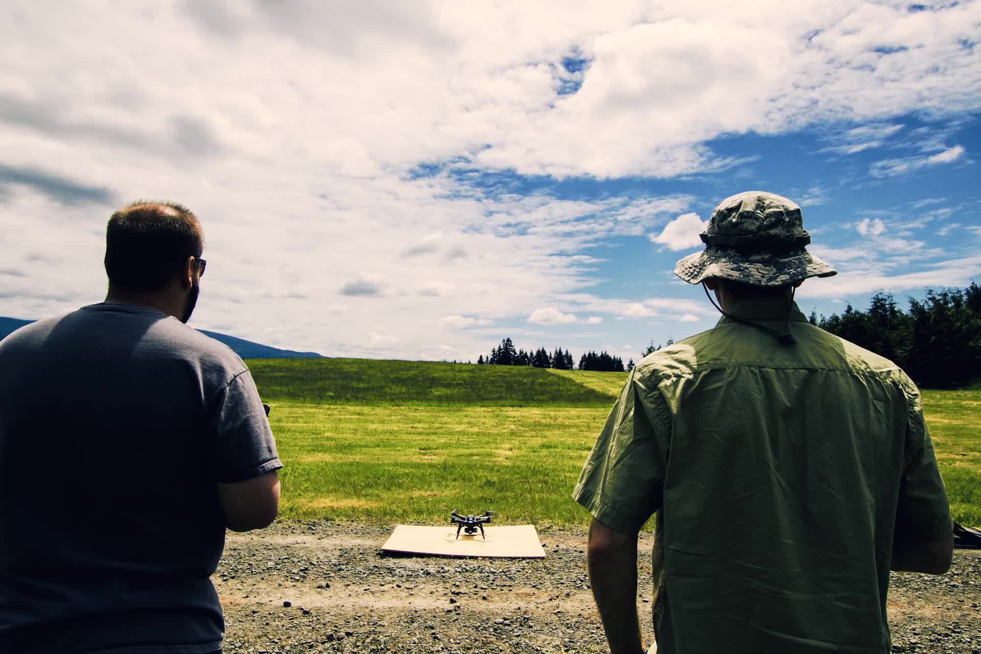 Operator launching a survey drone in the field